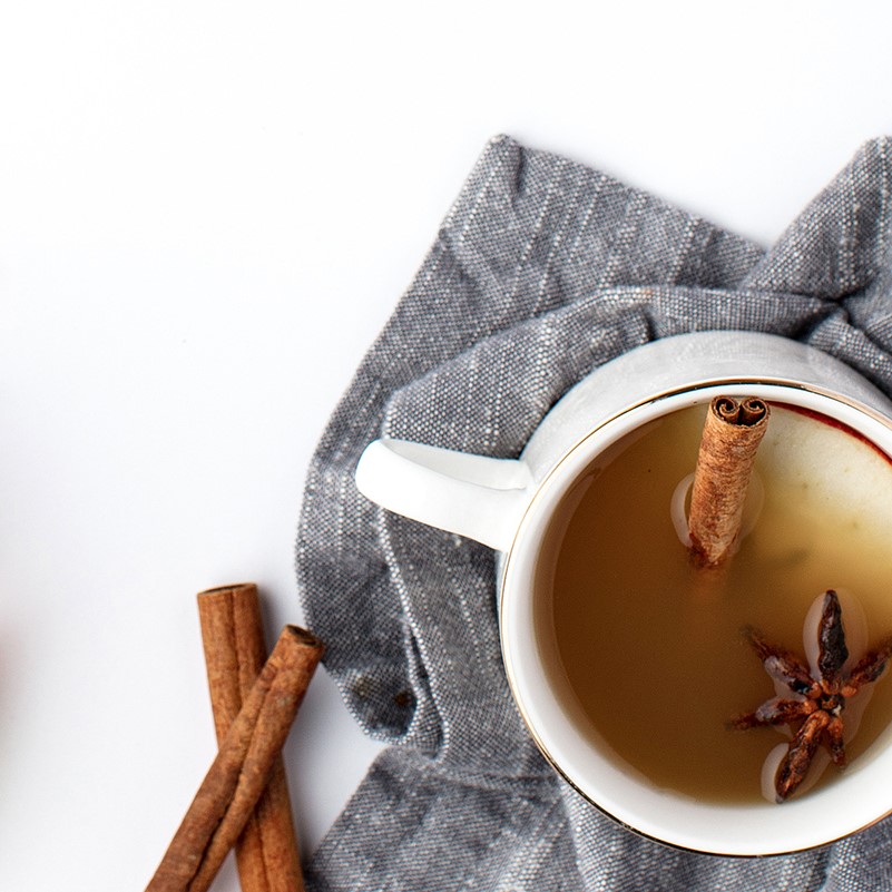 Cinnamon sticks and star anise in a cup